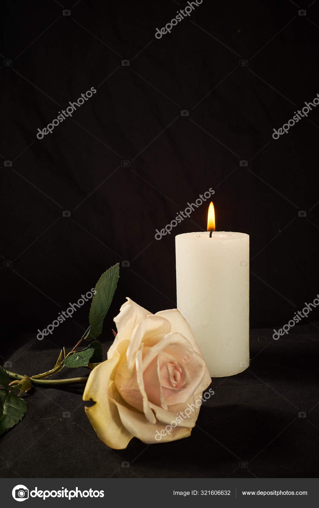 Burning candle and a beautiful rose on a black background Stock Photo by  ©eugenehill 321606632