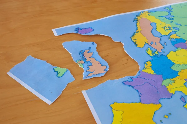 a torn paper map symbolizing the UK leaving the European Union or Brexit