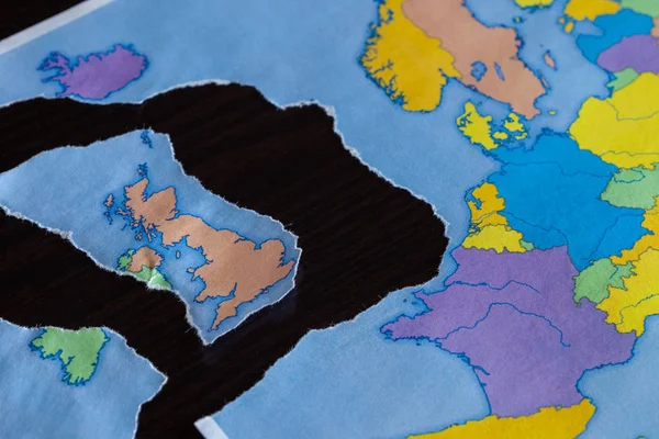 A torn paper map symbolizing the UK leaving the European Union or Brexit