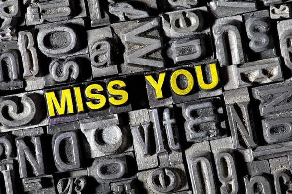 Old lead letters forming text Miss You