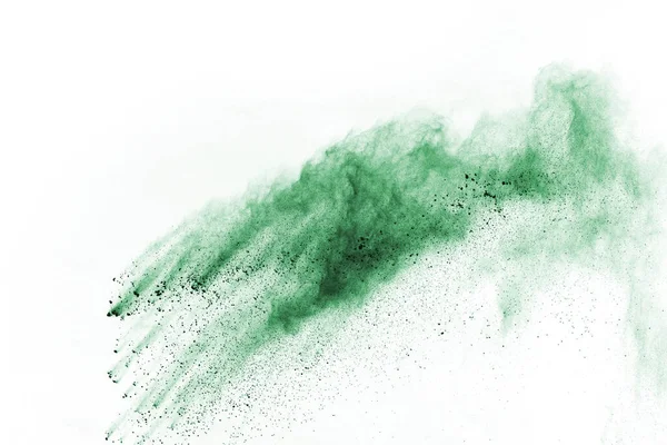 Green powder explosion on white background. Colored cloud. Colorful dust explode. Paint Holi.