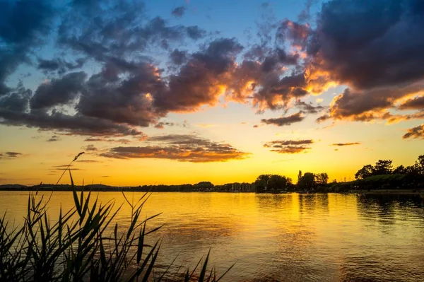 red clouds sunset lake constance summer time