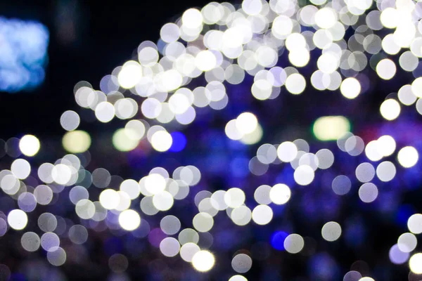 Bokeh effect of light sticks in the concert.  Blue light and blue tone.