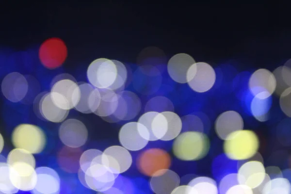 Bokeh effect of light sticks in the concert.  Blue light and blue tone.