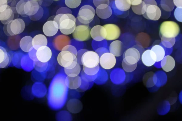 Bokeh effect of light sticks in the concert.  Blue light and blue tone.