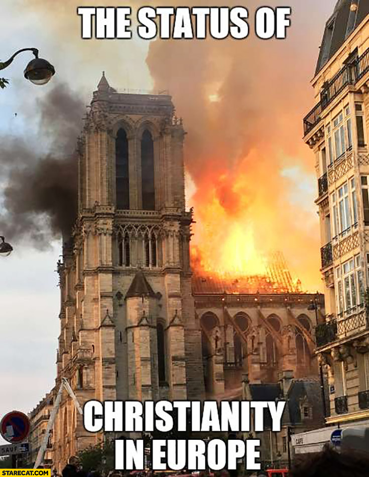 The status of christianity in Europe: Notre Dame cathedral on fire burning