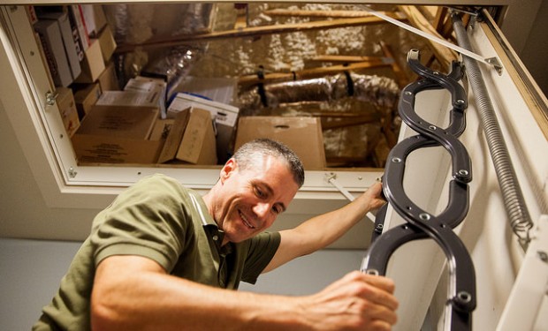 Steve Bijansky climbs down from the attic. 