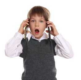 Photo of Little boy with smartphones on white background