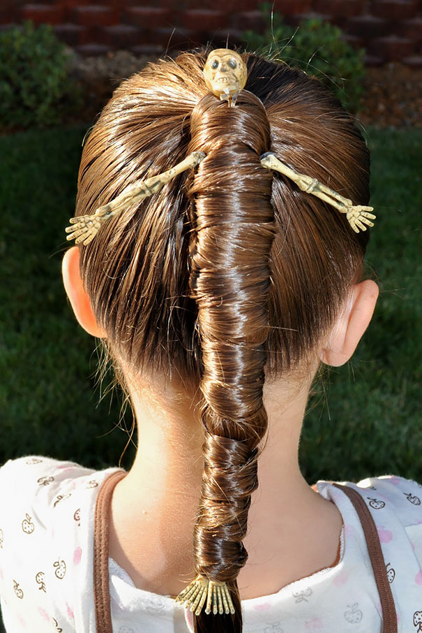 Creative crazy hair day style with hair wrapped around a skeleton figure.