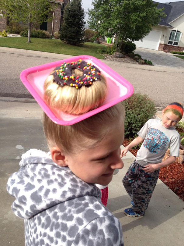 Crazy Hair Day idea with a hair bun styled as a doughnut on a pink plate, complete with sprinkles.