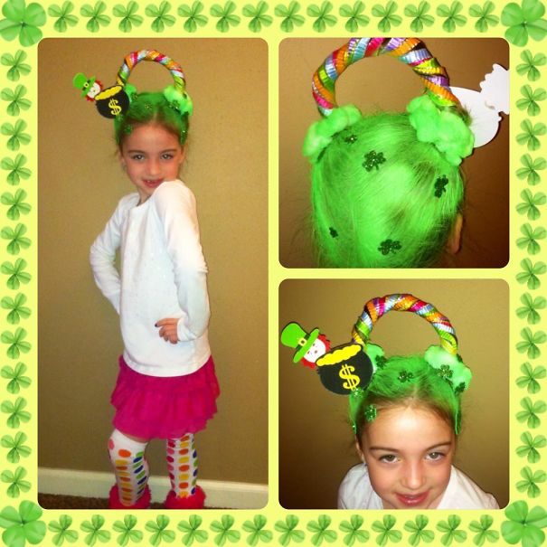 Girl with a colorful crazy hair day style featuring bright green hair, rainbow arch, and festive decorations.