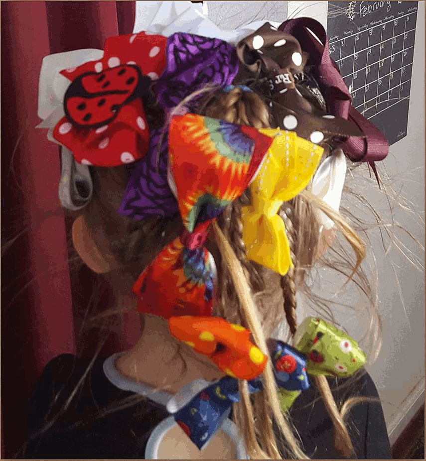 Colorful hair bows in a creative and fun crazy hair day style.