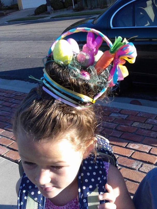 Child with a colorful Easter-themed crazy hair day style featuring eggs, a bunny, and a carrot.