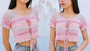 woman wearing a crochet crop cardigan with tie front