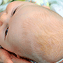 image of baby having nappy changed