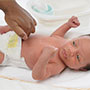 image of baby having his nappy changed