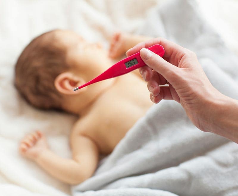 baby laying down being checked