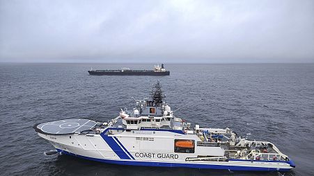 The oil tanker Eagle S, background, and the Finnish Border Guard ship Turva at sea outside Porkkalanniemi, 26 December, 2024