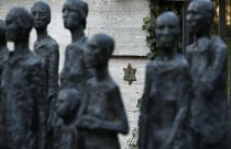 FILE - A star of David behind a sculpture by German artist Will Lammert is pictured at a Jewish cemetery and memorial in Berlin, Germany, Thursday, Oct. 31, 2013