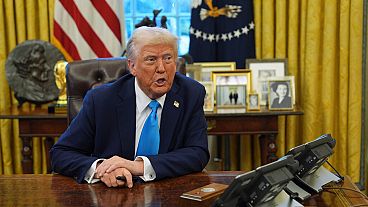 President Donald Trump speaks to reporters as he signs executive orders in the Oval Office of the White House, Tuesday, Feb. 4, 2025, in Washington.