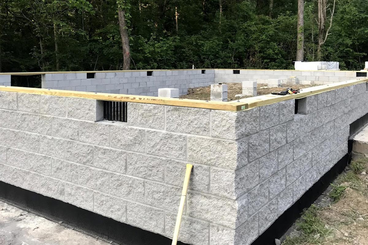 Crawl space foundation constructed with split-face concrete blocks