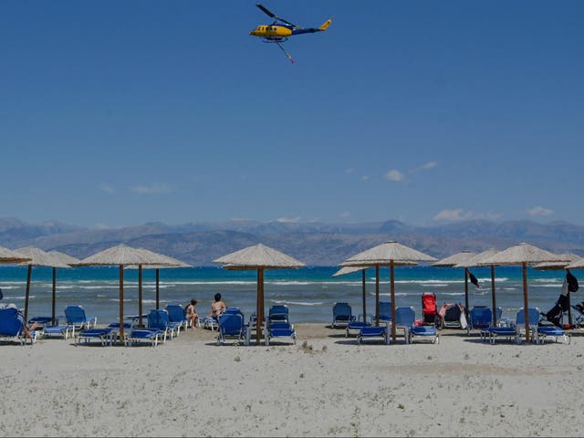 <p>A helicopter on its way to a wildfire on Rhodes earlier this week</p>