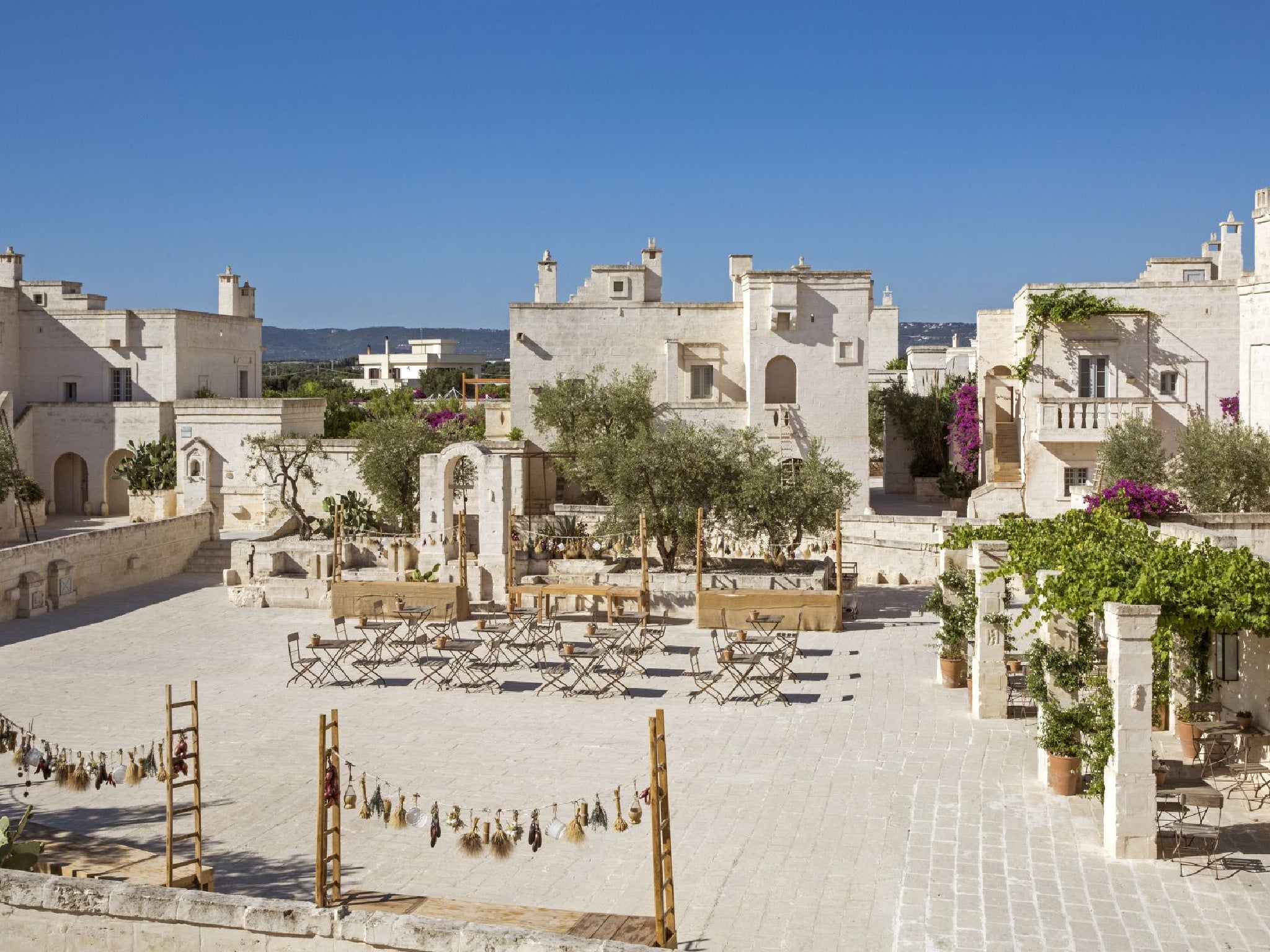 A traditional village square hosts a weekly fiesta with cooking demos and live entertainment