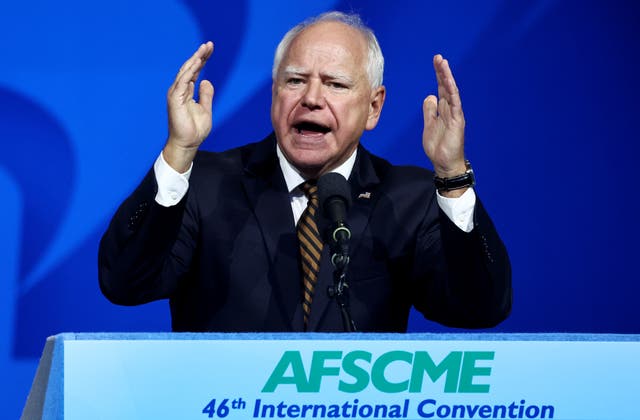 <p>Democratic vice presidential candidate Minnesota governor Tim Walz defends his military record at the 46th International Convention of the American Federation of State</p>