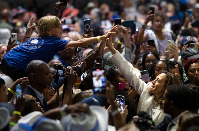 <p>Kamala Harris high-fives a supporter at a rally in Savannah, Georgia on Thursday</p>