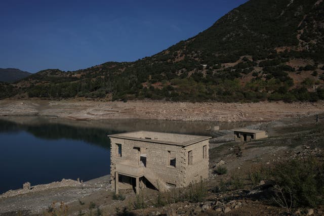 <p>The reappearing remains of buildings of the village of Kallio, which was intentionally flooded in 1980 to create a reservoir that would help meet the water needs of Greek capital Athens</p>