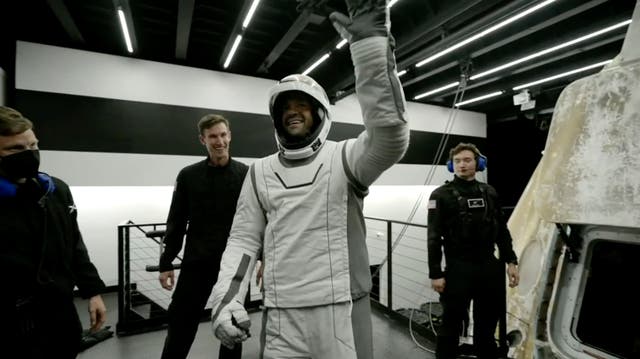 <p>Tech entrepreneur Jared Isaacman, centre, reacts as he gets out of the capsule upon its return to Earth</p>