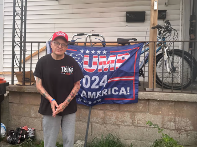 <p>Anna Kilgore in Springfield, Ohio with her Trump-Vance hat and flag. The Springfield resident told police last month that her Haitian neighbors may have stolen her cat Miss Sassy. The cat turned out to be hiding in her basement the whole time</p>