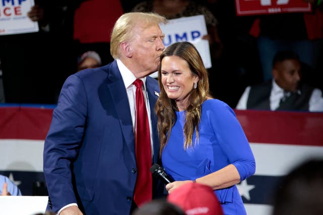 <p>Donald Trump attends a town hall event in Flint, Michigan with Arkansas Governor Sarah Huckabee Sanders. The governor sneered at Kamala Harris during the event for not having biological children</p>