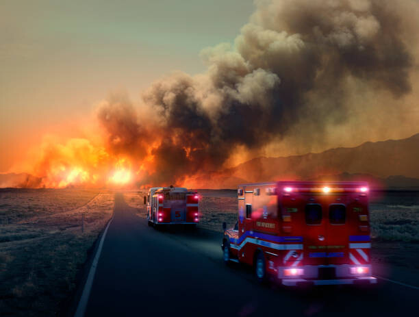 Fotografi Ambulance driving to forest fire in desert