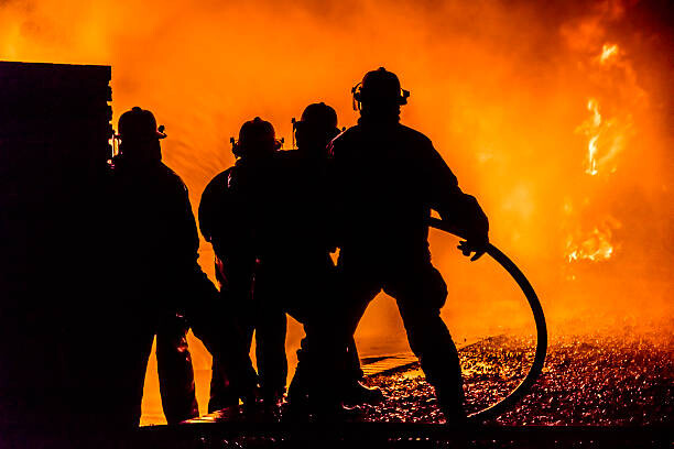 Fotografi Firefighters silhouette