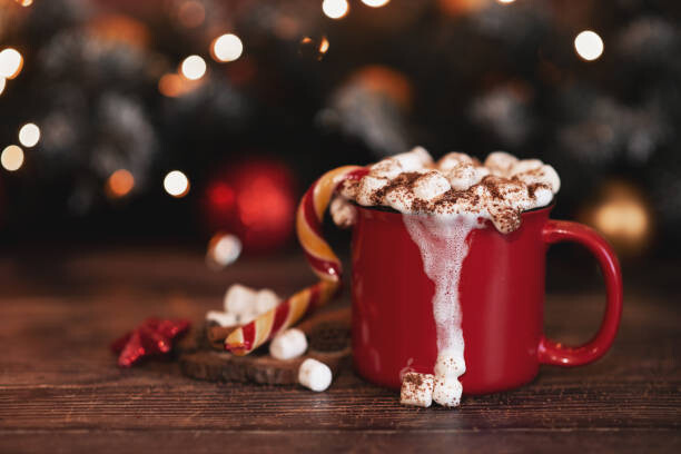 Kunstfoto wooden desk space red mug and xmas tree