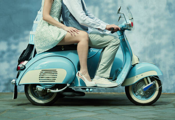 Obraz na płótnie Couple riding vintage scooter