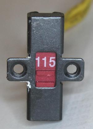 The 115/230 V switch.