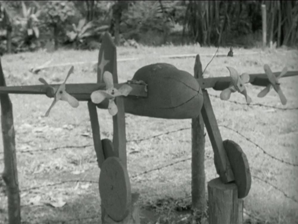 A closeup of the model airplane. From Attenborough's Cargo Cult documentary.