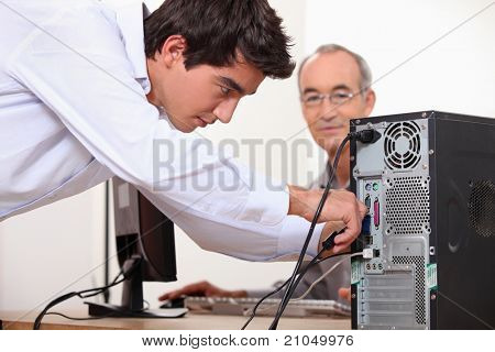 Man fixing a computer