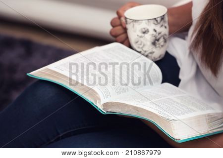 Close Up Of Young Lady Studying Her Bible