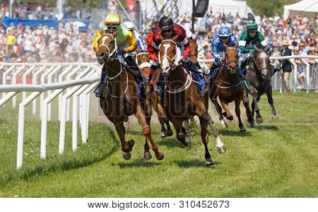 Stockholm, Sweden - June 06, 2019: Closeup Of Tough Fight Between Many Jockeys Riding Arabian Race H