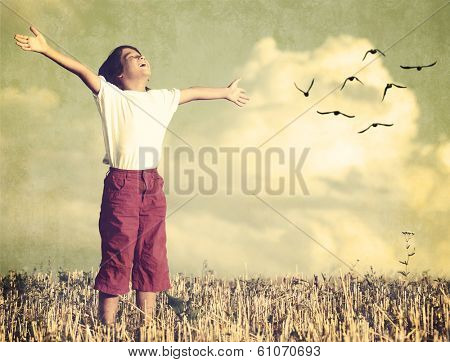 Colorized kid breathing fresh air with birds flock flying in background