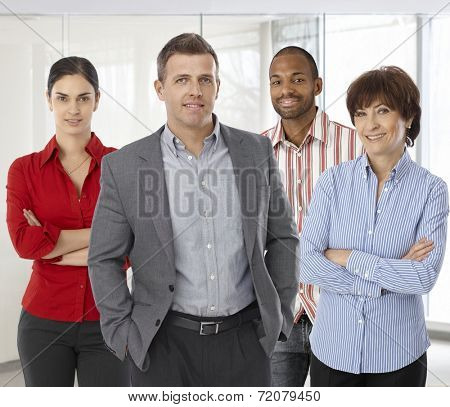 Diverse team of smiling office workers. Boss and employees of successful casual small business.