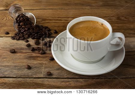 Strong coffee on the wooden background. Strong coffee. Morning coffee. Coffee break. Strong coffee. Coffee cup. Cup of coffee. Coffee mug.