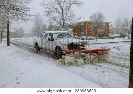 Snow Plow Removing Snow From Street. Snowplow Trucks Removing Snow On The Road Street