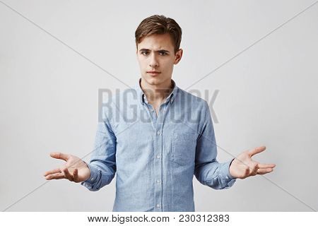 Portrait Of Handsome Boy Who Looks Uncertain. Boy Dressed Up To Go To The Bar With Girl He Met In So