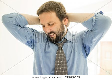 Man with Hyperhidrosis sweating very badly under armpit