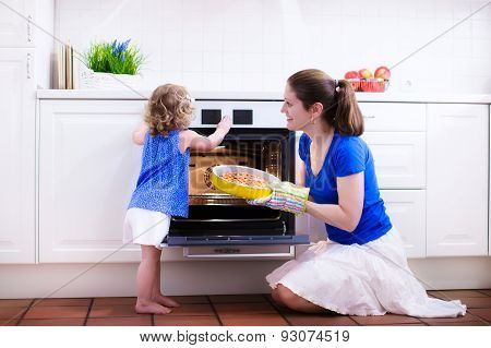 Mother And Child Baking A Cake.