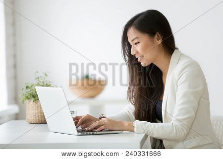 Smiling Young Asian Businesswoman Using Computer At Home Office Workplace, Happy Korean Employee Wor